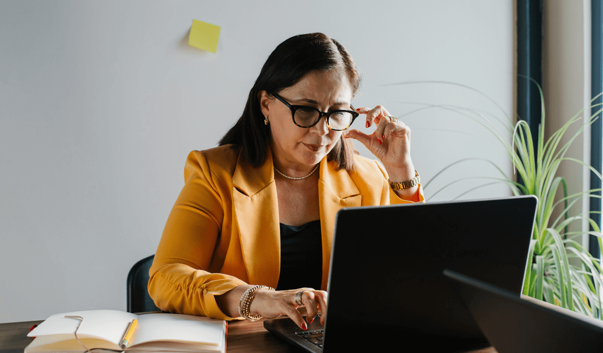 Marketing executive reviewing startup campaign performance on a laptop