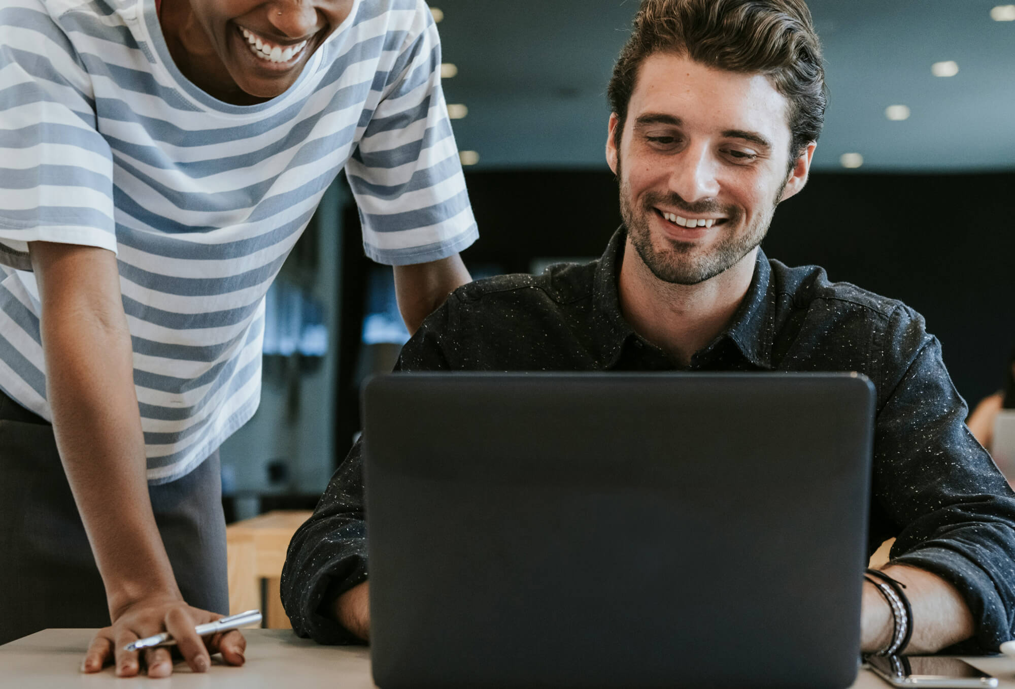A team reviewing their HubSpot setup together on a laptop.