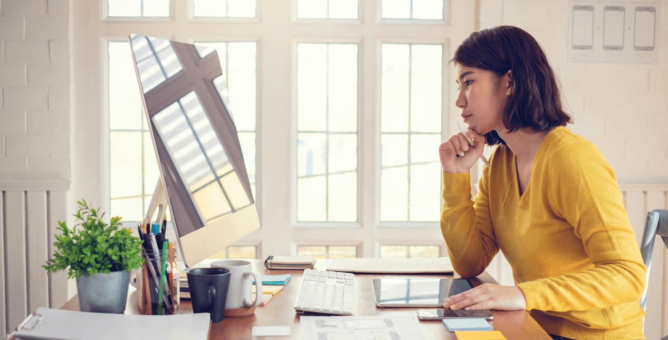 SaaS founder evaluating marketing performance at her desk