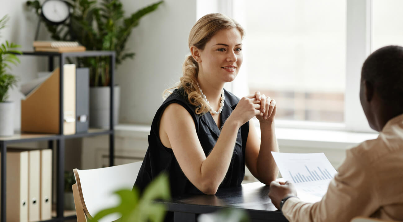 Fractional CMO presenting marketing strategy to founder in office meeting