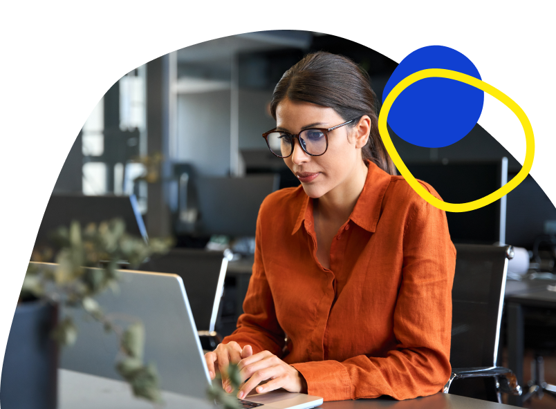 Marketing strategist working at a laptop